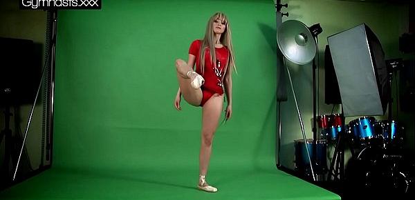  Red Dressed Gymnast Doing Spreads
